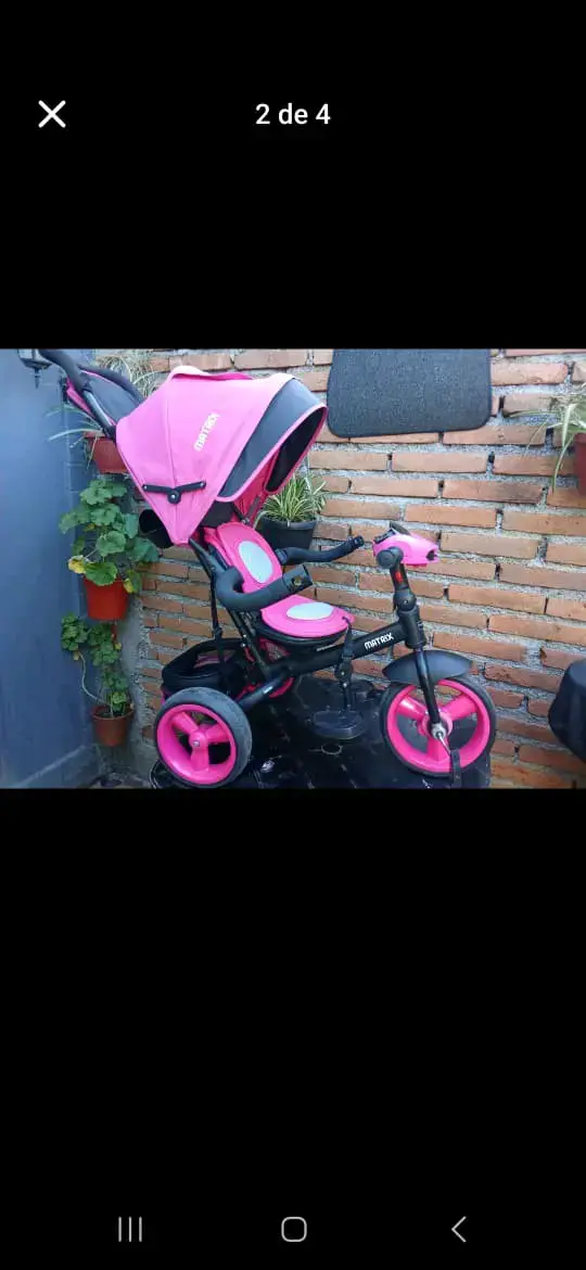 Triciclo infantil rosa con toldo - 1