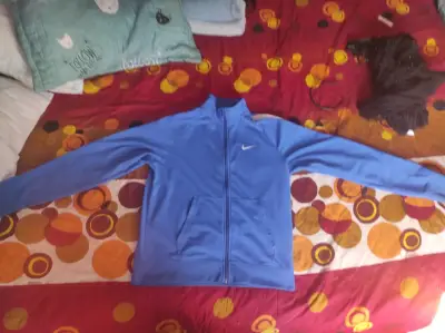 Chaqueta deportiva azul Nike para hombre - miniatura 1