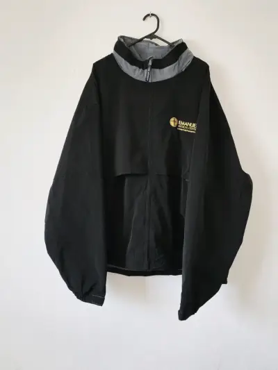 Chaqueta cortaviento negra con logo Emanuel Medical Center - miniatura 1