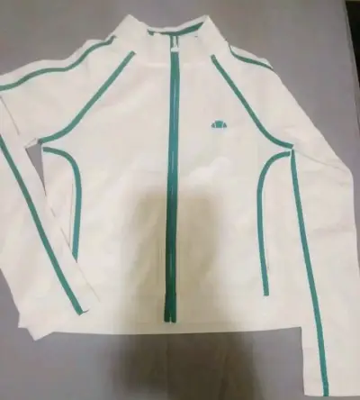 Chaqueta deportiva blanca con detalles verdes - miniatura 2