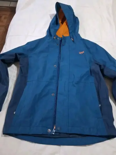 Chaqueta impermeable azul para niños Uppí - miniatura 2