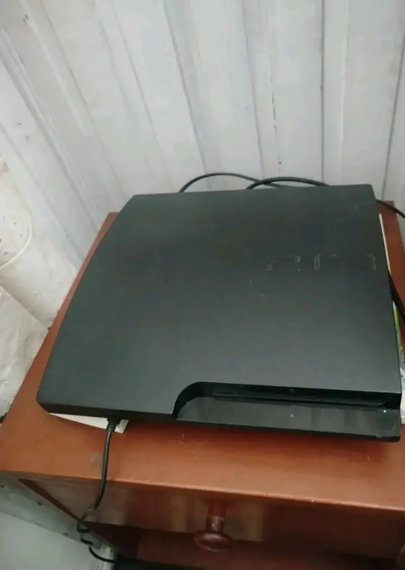 Consola PlayStation 3 con control y juegos - 1