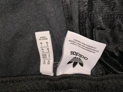 Pantalon deportivo negro Adidas con franjas bla - miniatura 2