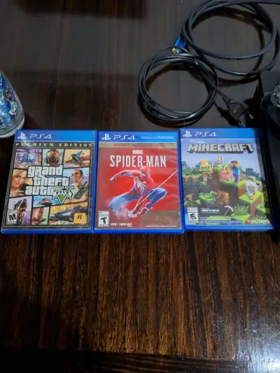 Consola PlayStation 4 con dos controles y juegos - miniatura 2