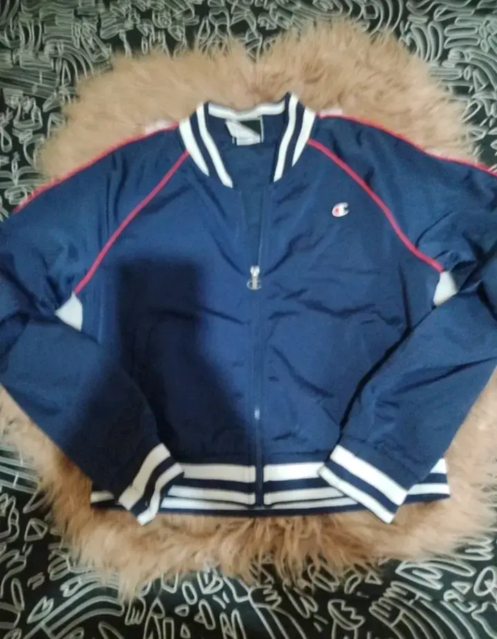 Chaqueta deportiva azul Champion con detalles blan - 1