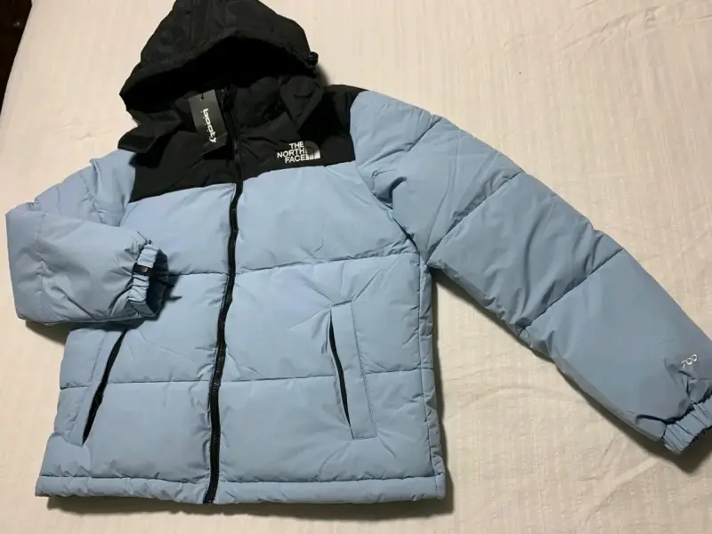 Chaqueta The North Face azul claro con capucha - 1