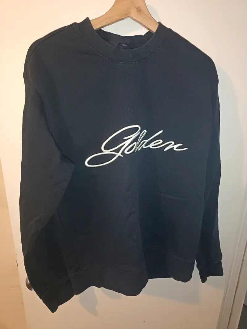 Polerón negro H&M con logo bordado - 1