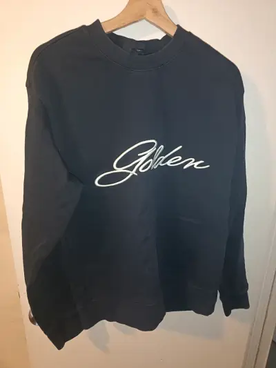 Polerón negro H&M con logo bordado - miniatura 1
