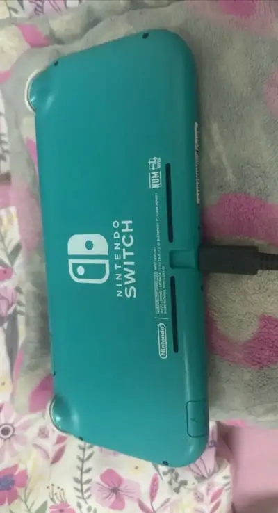 Nintendo Switch Lite turquesa con cargador - miniatura 3