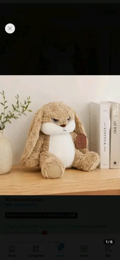 Peluche de conejo marrón con expresión divertida - miniatura 1