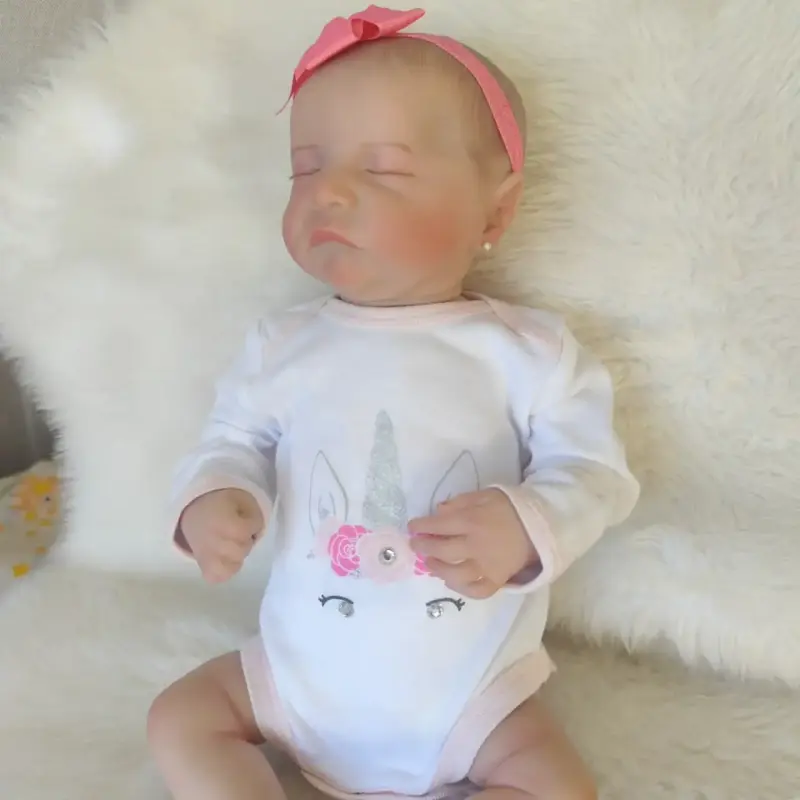 Muñeca reborn con chupete y lazo - 6