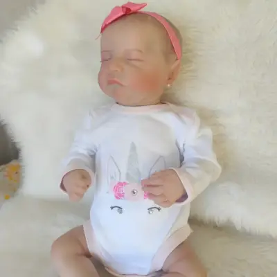 Muñeca reborn con chupete y lazo - miniatura 6