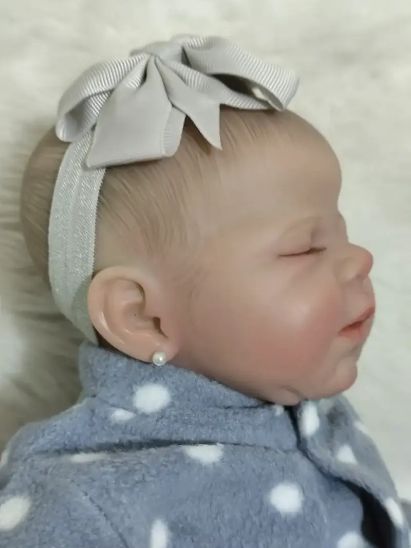 Muñeca reborn bebé con pijama azul - 2