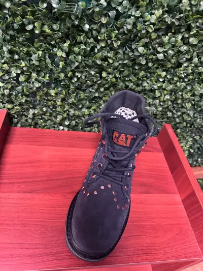 Botas negras con tachas Caterpillar para mujer - miniatura 1