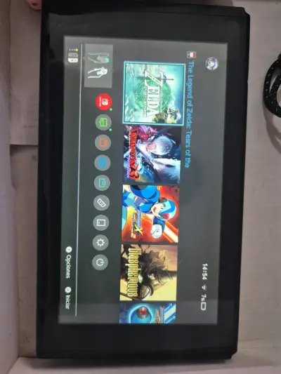Consola Nintendo Switch con accesorios y juego Zelda - miniatura 1