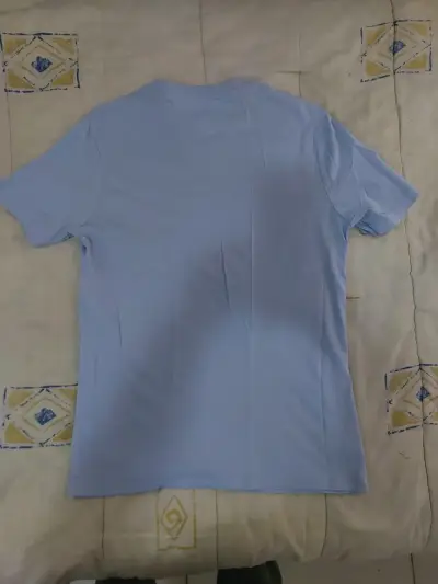 Polera Tommy Hilfiger azul claro para hombre - miniatura 2