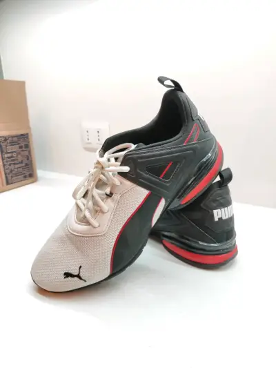 Zapatillas deportivas Puma negras y blancas - miniatura 1