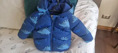 Parka de niño azul con dinosaurios primark - miniatura 1