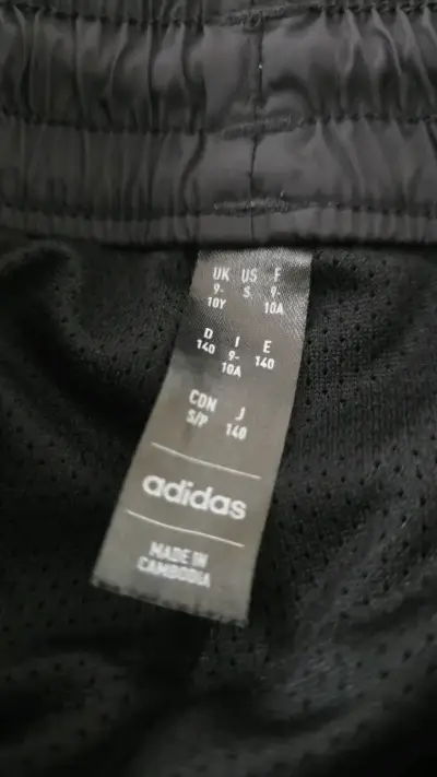 Pantalones deportivos negros con franjas rojas Adidas - miniatura 2