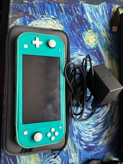 Nintendo Switch Lite turquesa con cargador - miniatura 1