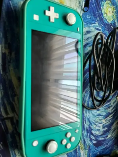 Nintendo Switch Lite turquesa con cargador - miniatura 2