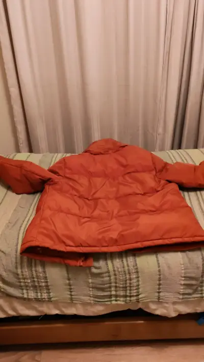 Chaqueta acolchada naranja para invierno - miniatura 1