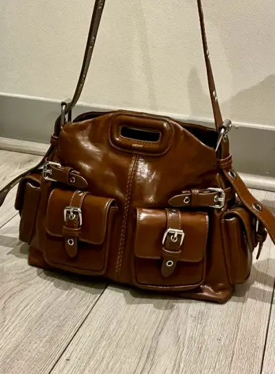 Bolso de cuero marrón con múltiples bolsillos - miniatura 1