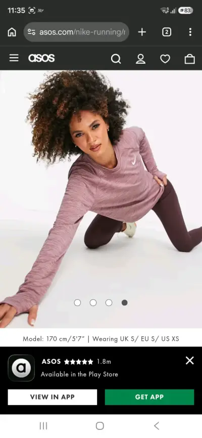 Polera deportiva Nike morada para mujer - miniatura 1