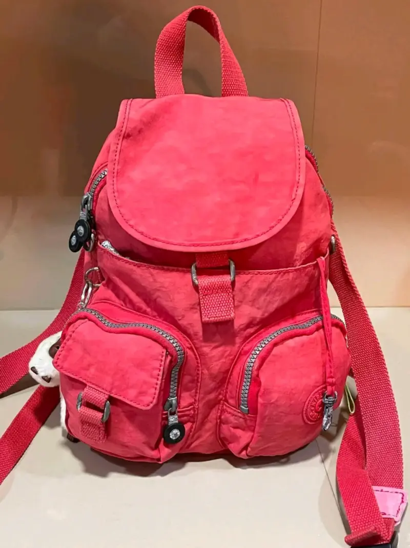 Mochila Kipling roja con múltiples bolsillos - 1
