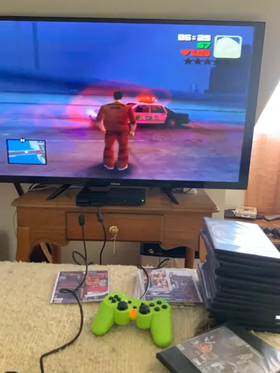 Consola PlayStation 2 con juegos y controles - miniatura 3