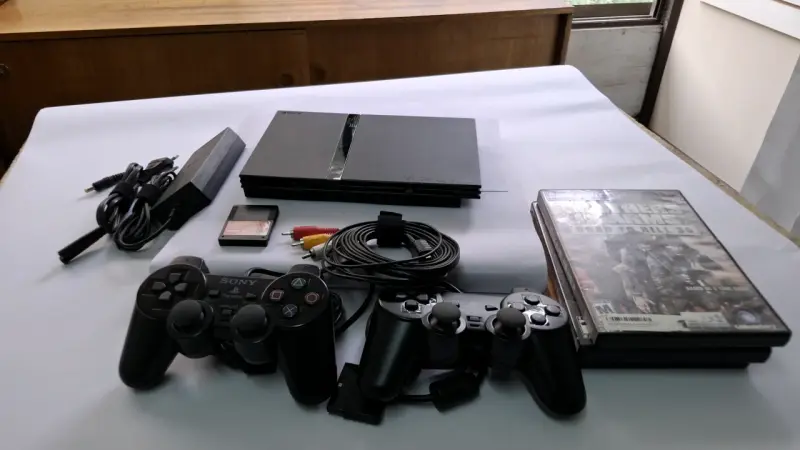 Consola PlayStation 2 con juegos y accesorios - 1