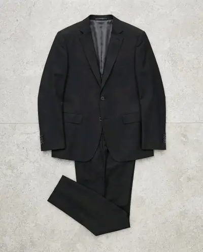 Traje formal negro para hombre en buen estado. - miniatura 1