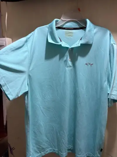Polera Polo Celeste Greg Norman - miniatura 1