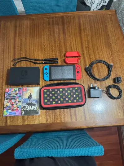Nintendo Switch v1 con juegos y accesorios - miniatura 1