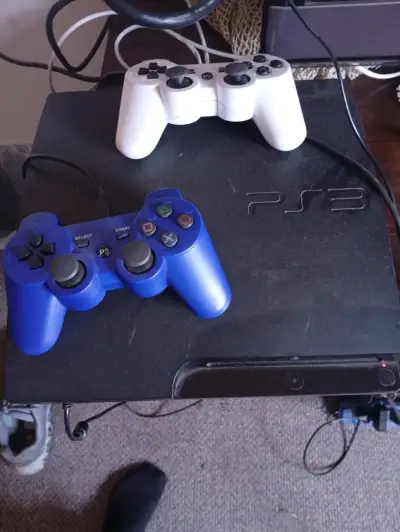 Consola PS3 con juegos y controles - miniatura 1