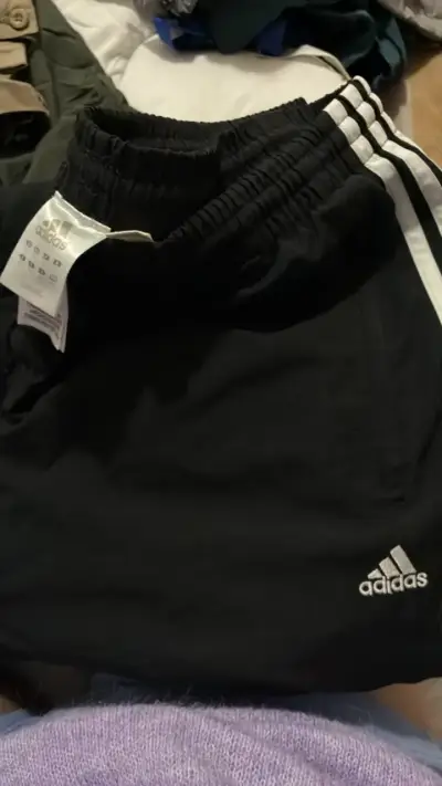 Pantalones deportivos negros Adidas con rayas - miniatura 1