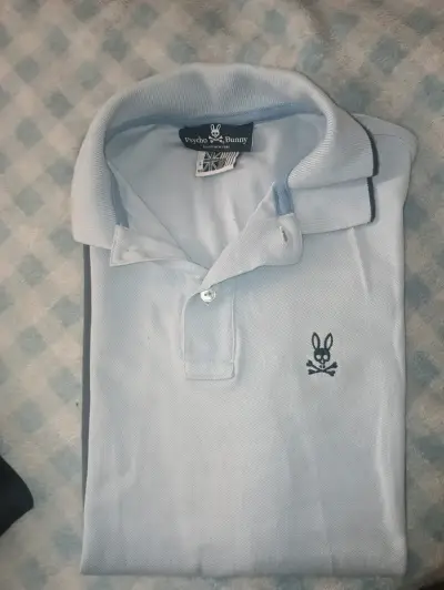 Polera Polo Psycho Bunny Hombre Azul Claro y Negro - miniatura 1