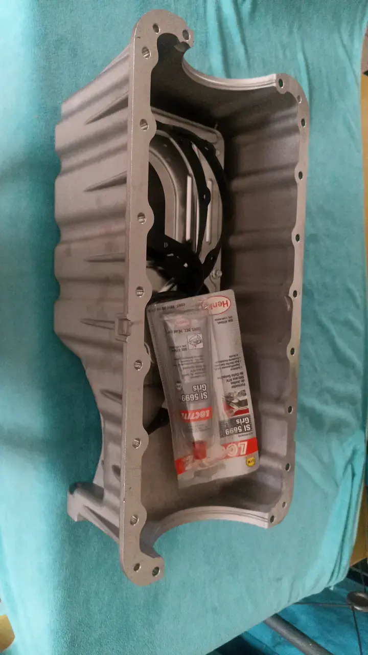 Cárter de aceite para motor con sellador