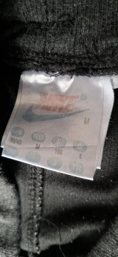Pantalones deportivos Nike grises con cierre - miniatura 5