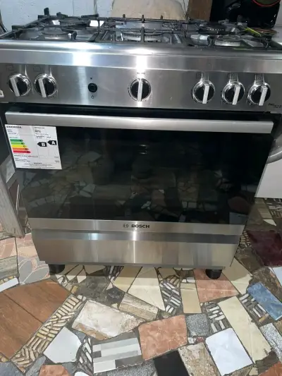 Cocina a gas con horno Bosch de acero inoxidable - miniatura 3