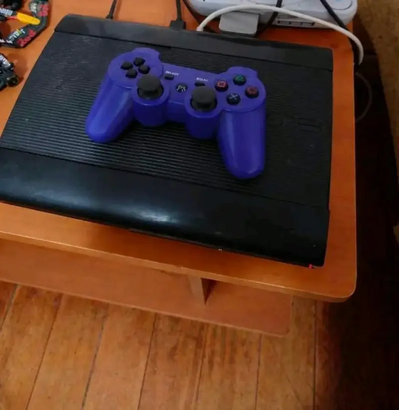 Consola PlayStation 3 con control y juegos - 2