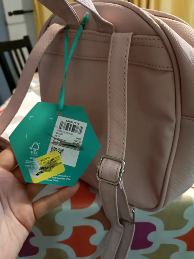 Mochila pequeña rosa con pompón decorativo - 1