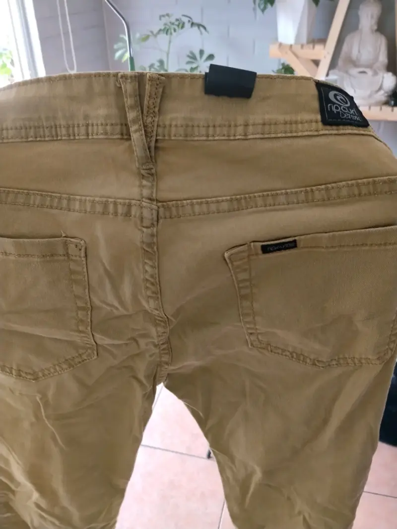 Pantalones Rip Curl mostaza niña - 1
