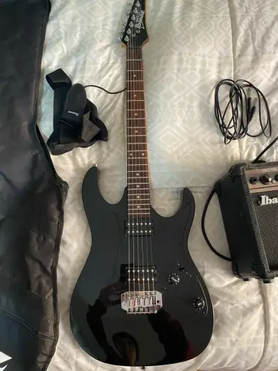 Guitarra Eléctrica Ibanez con Amplificador y Funda - miniatura 2