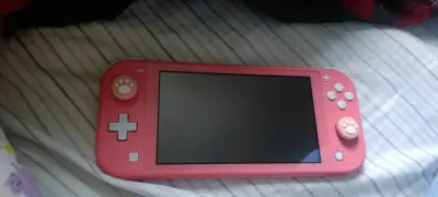 Consola Nintendo Switch Lite rosa en buen estado - miniatura 1
