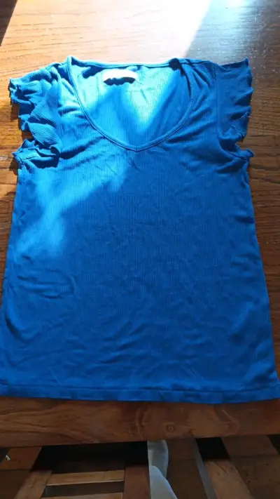 Polera azul sin mangas para mujer - miniatura 1