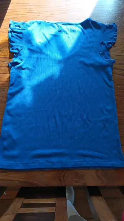 Polera azul sin mangas para mujer - miniatura 2
