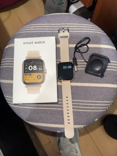 Smartwatch beige con cargador y caja original - miniatura 1