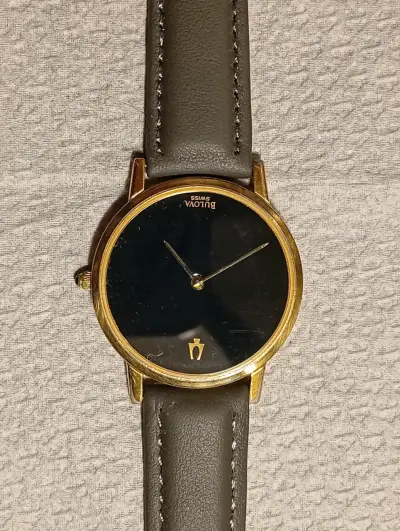 Reloj Bulova suizo dorado con correa de cuero - miniatura 1