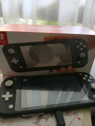 Consola Nintendo Switch Lite gris en buen estado - miniatura 1